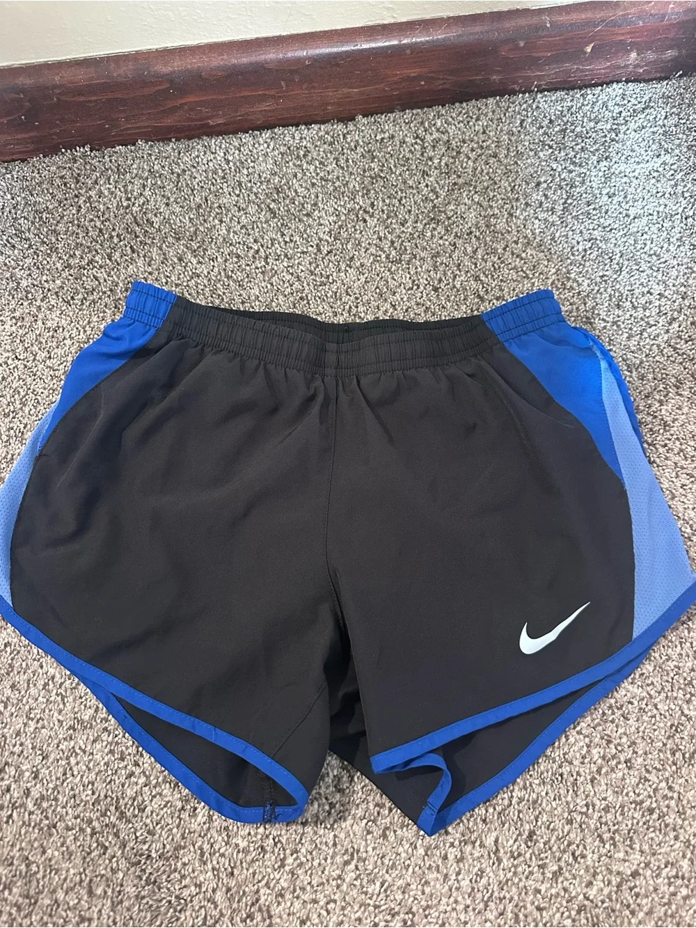 Nike Black Shorts with Blue Trim and Side Panels